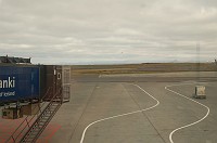 In Iceland we had maintenance problems on our connecting flight, so we had a four-hour wait.  This is just a view of Iceland looking at the mountains in the distance.